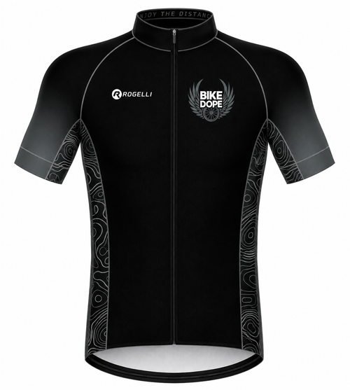 A black short-sleeve cycling jersey with a full front zipper, featuring the 'ROGELLI' brand logo on the right chest and a 'BIKE DOPE' winged logo on the left chest. The jersey has a subtle gray gradient on the sleeves and sides with white abstract wave patterns.